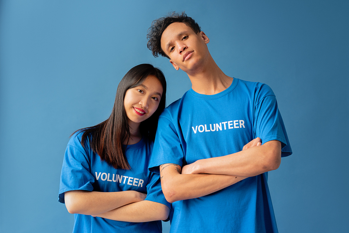 A Man and Woman in Blue Shirt Standing